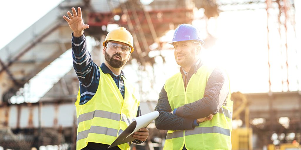 builders and labourers inspecting